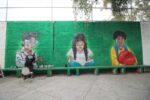 Con un mural de niños mexicanos celebran el Día de la Bandera en primaria de la GAM
